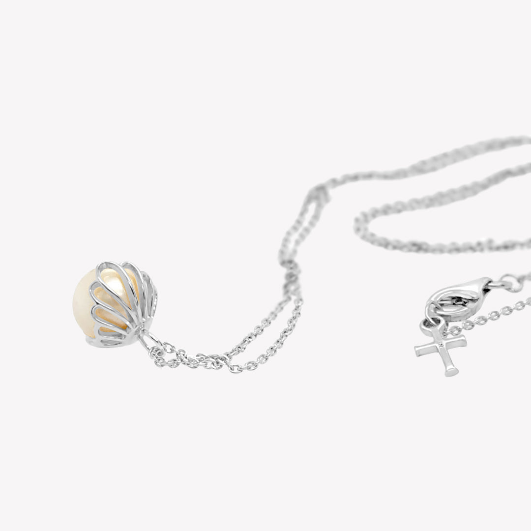 Rizen Jewelry shell encased pearl necklace in sterling silver from the Becoming Collection.