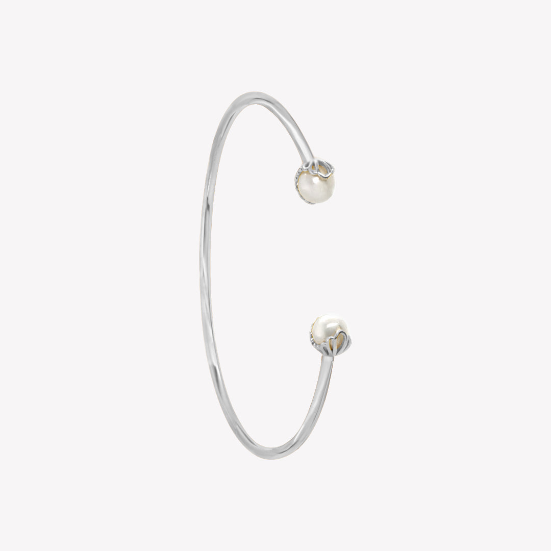 Rizen Jewelry shell encased pearl bangle in sterling silver from the Becoming Collection.