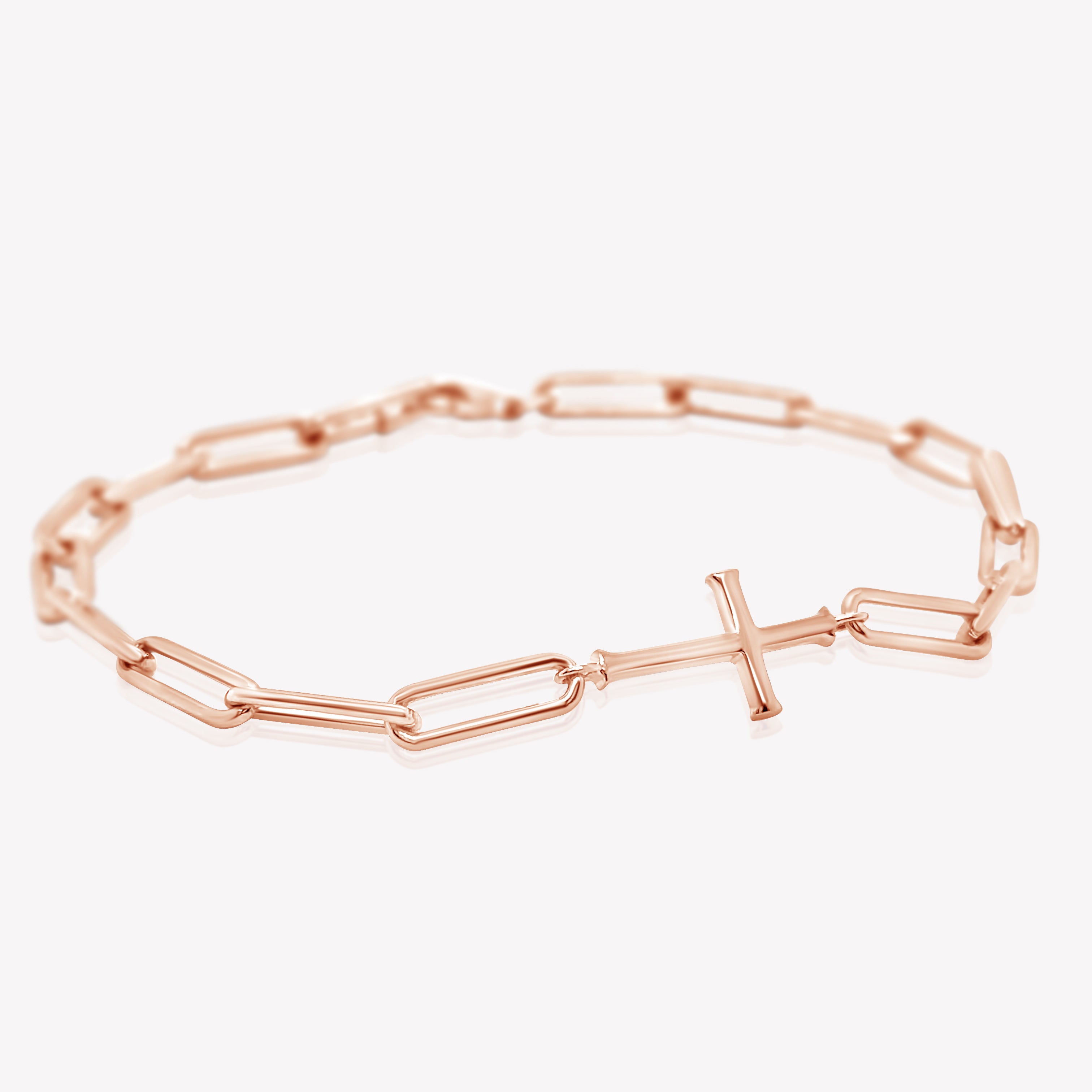 Rizen Jewelry Chain Breaker Bracelet in 18kt rose gold.  Elegant Cross Pendant breaks up the contemporary paper clip link chain with classic lobster clasp  closure, and circular Rizen tag on last link of chain.