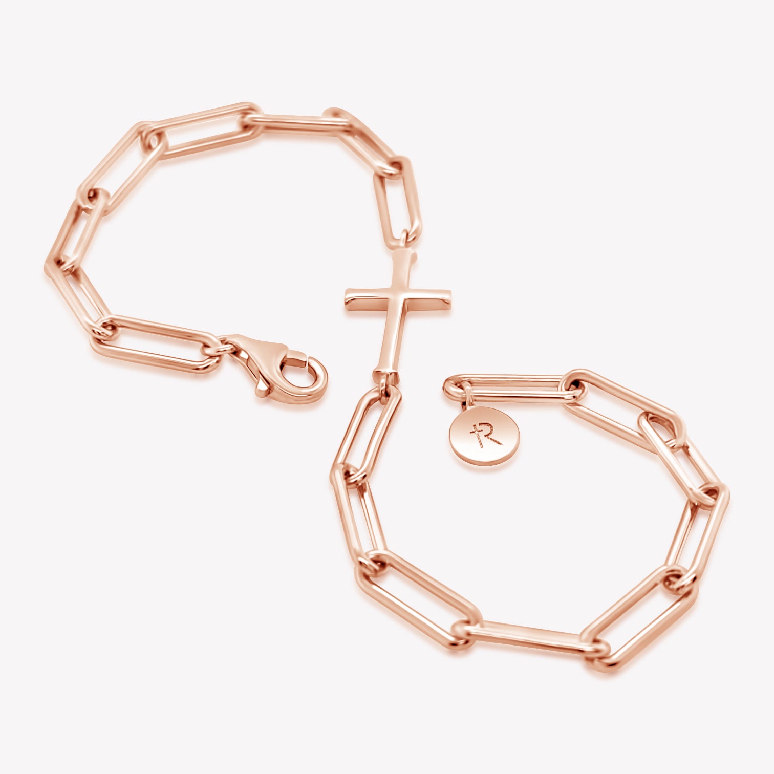 Chain breaker cross bracelet in 18k rose gold plated from the Calvary collection.  A timeless baptism gift by Rizen Jewelry.
 