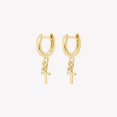 Rizen Jewelry gold vermeil Cross Huggie Hoop Earrings with white topaz stone dangle from the Calvary Collection.