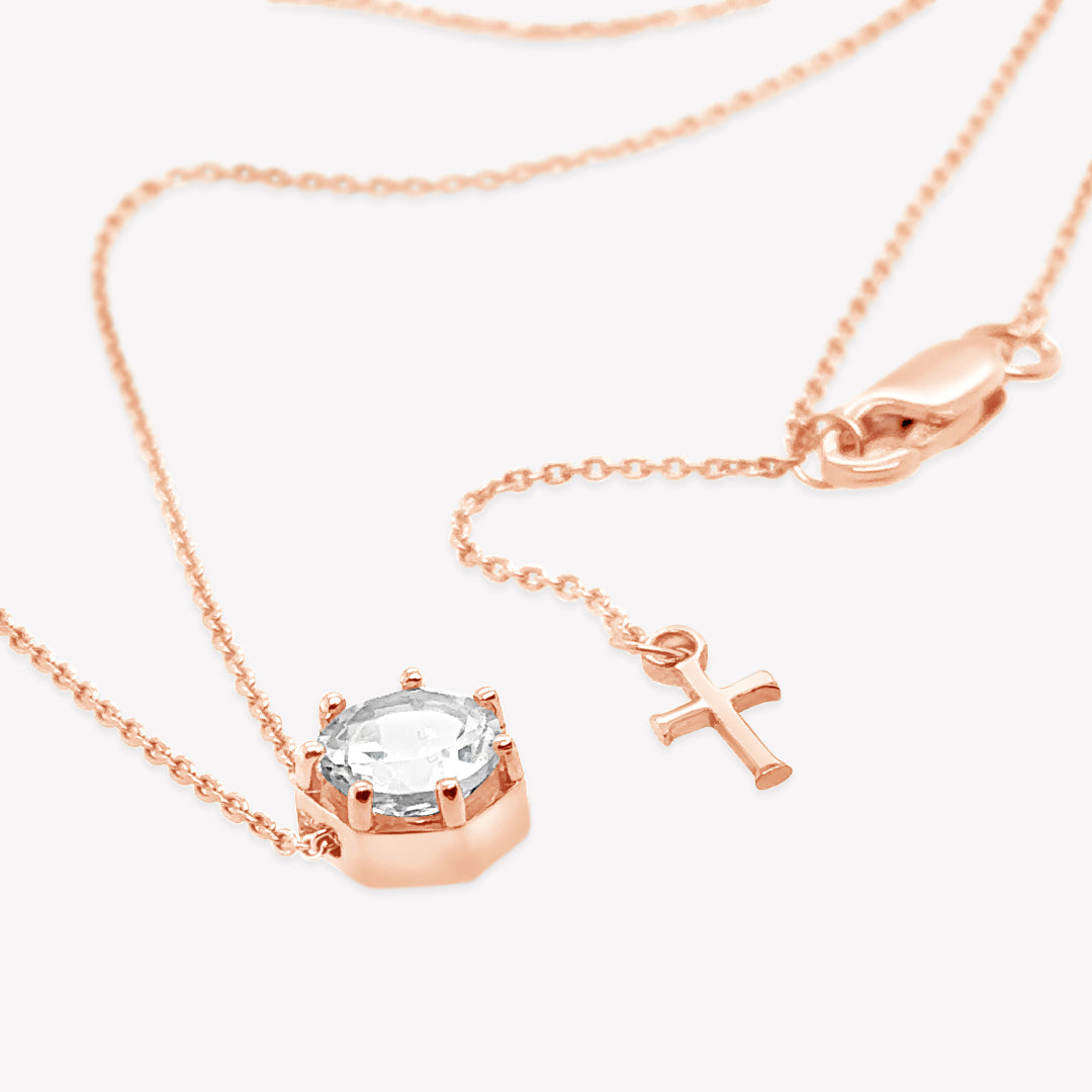 Rizen Jewelry Ebenezer solitaire white topaz necklace in rose gold vermeil set in 7 prongs in a heptagon setting from the Chispa Collection.