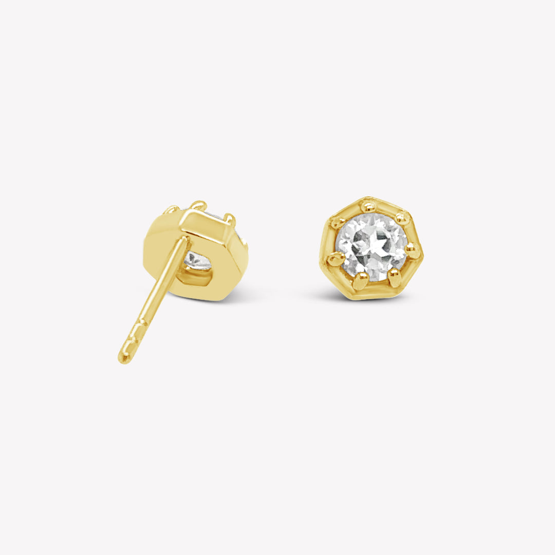 Rizen Jewelry Ebenezer solitaire white topaz earring in gold vermeil set in 7 prongs in a heptagon setting from the Chispa Collection.