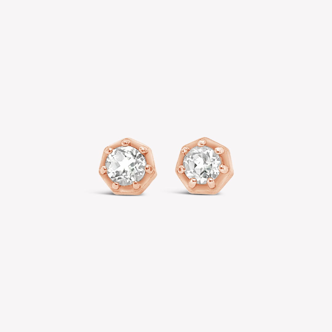 Rizen Jewelry Ebenezer solitaire white topaz earring in rose gold vermeil set in 7 prongs in a heptagon setting from the Chispa Collection.