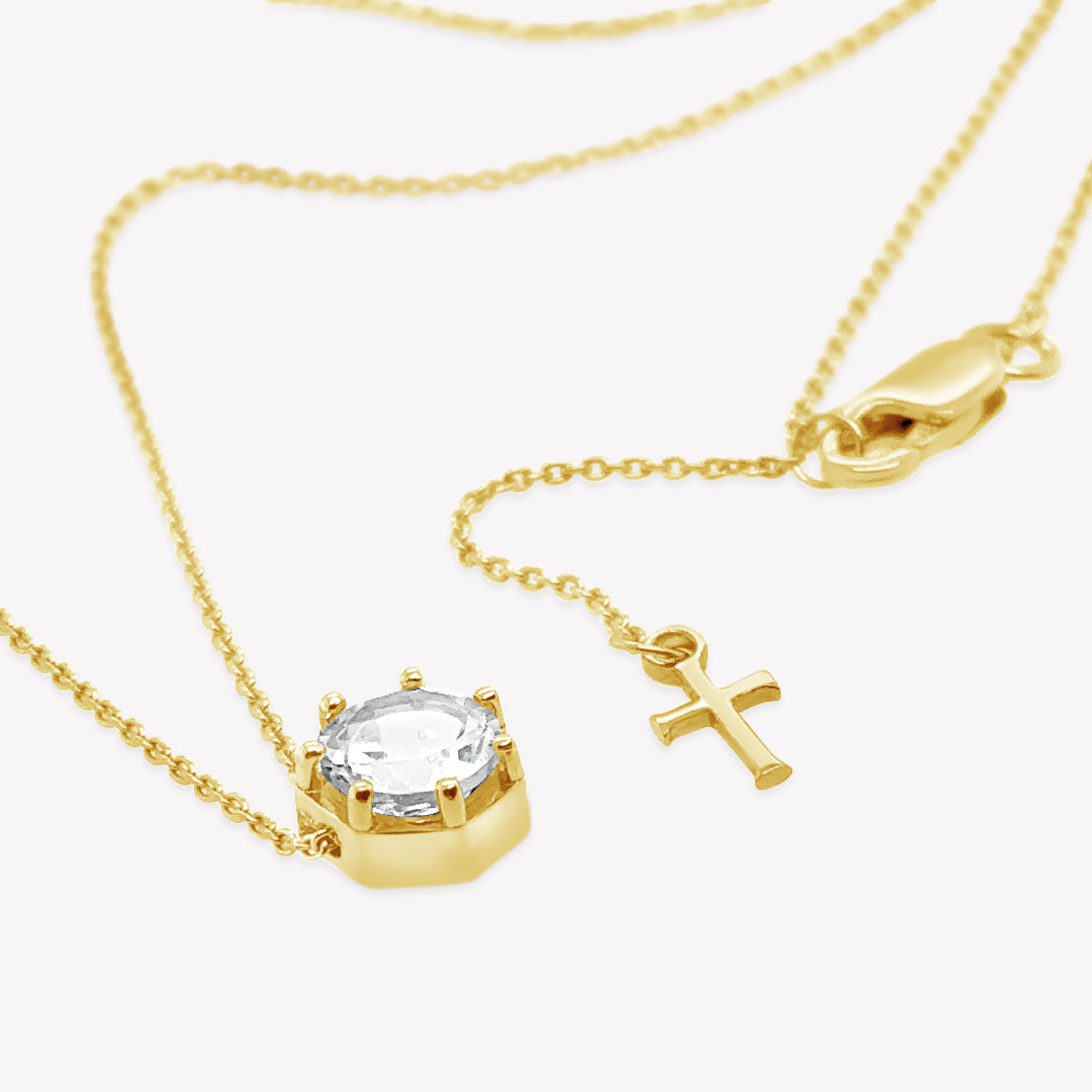 Rizen Jewelry Ebenezer solitaire white topaz necklace in gold vermeil set in 7 prongs in a heptagon setting from the Chispa Collection.