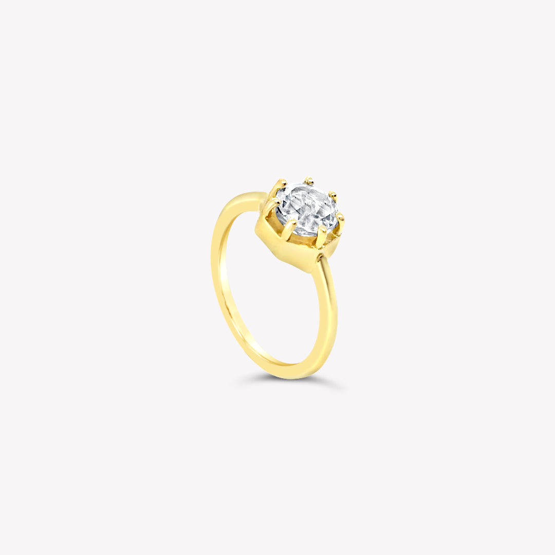 Rizen Jewelry Ebenezer Solitaire white topaz ring set with 7 prongs in 18k gold vermeil from the Chispa Collection.