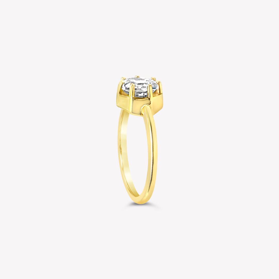 Rizen Jewelry Ebenezer Solitaire white topaz ring set with 7 prongs in 18k gold vermeil from the Chispa Collection.