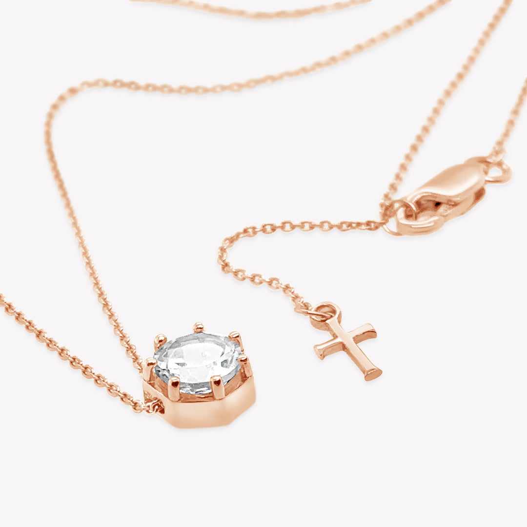 Rizen Jewelry Ebenezer solitaire white topaz necklace in rose gold vermeil set in 7 prongs in a heptagon setting from the Chispa Collection.