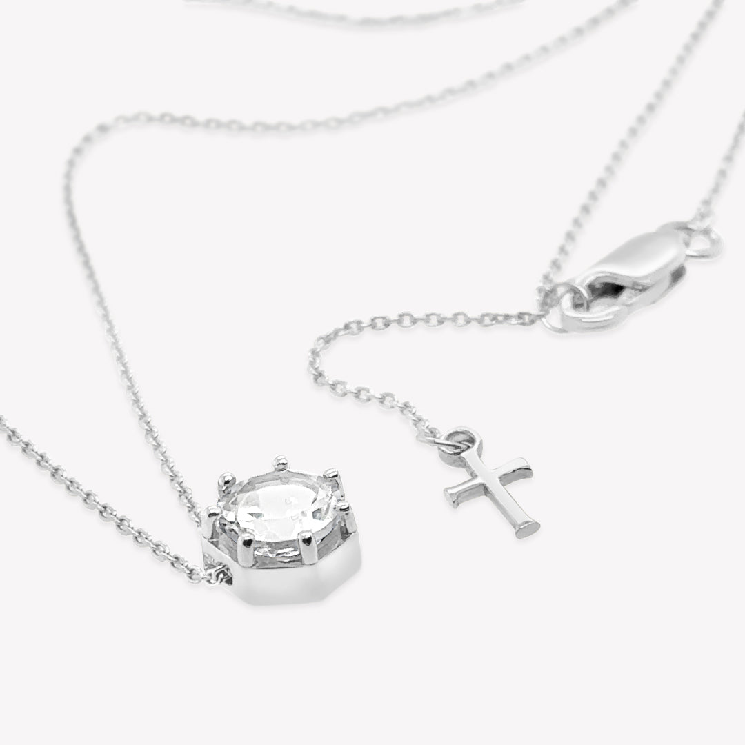 Rizen Jewelry Ebenezer solitaire white topaz necklace in sterling silver set in 7 prongs in a heptagon setting from the Chispa Collection.