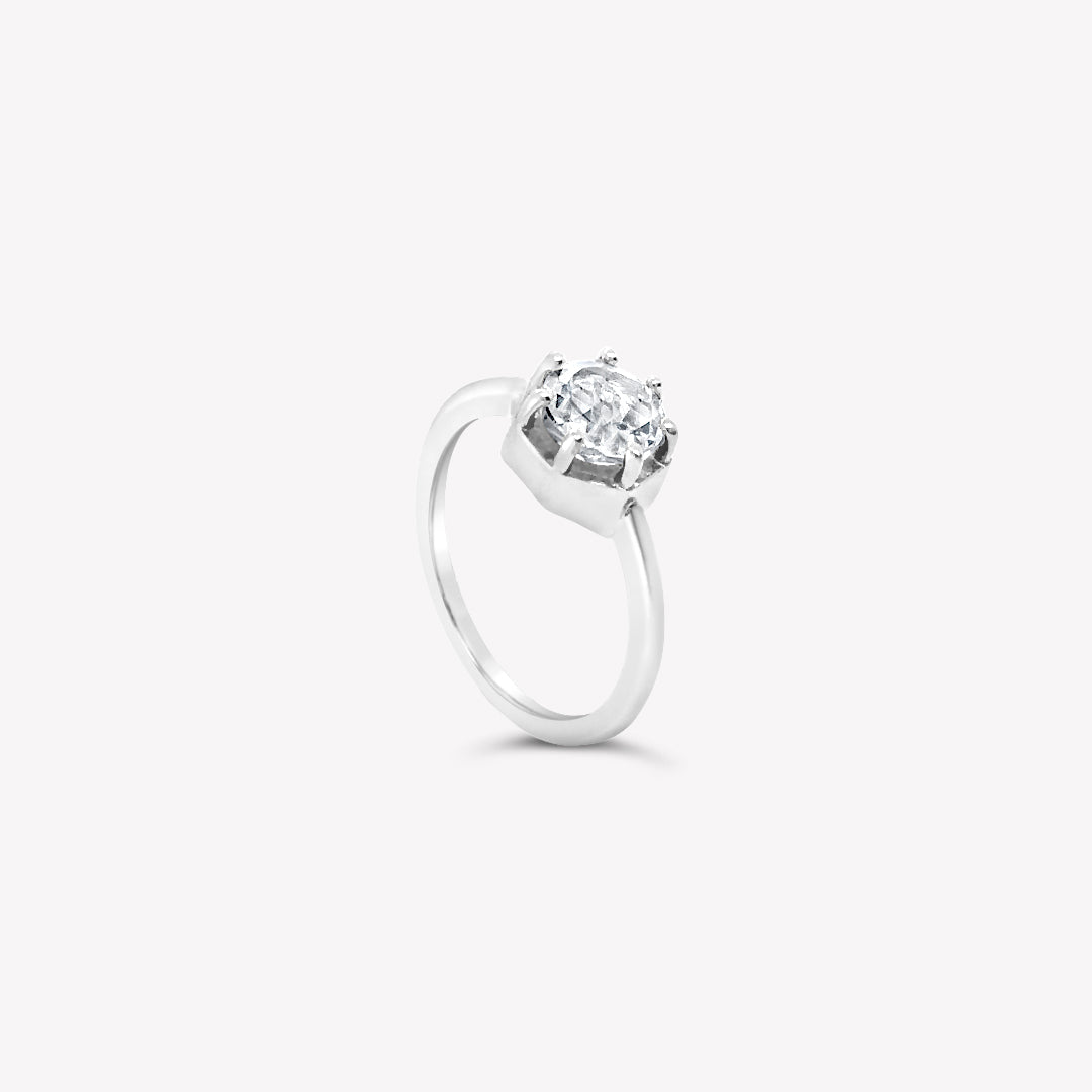 Rizen Jewelry Ebenezer Solitaire white topaz ring set with 7 prongs in sterling silver from the Chispa Collection.