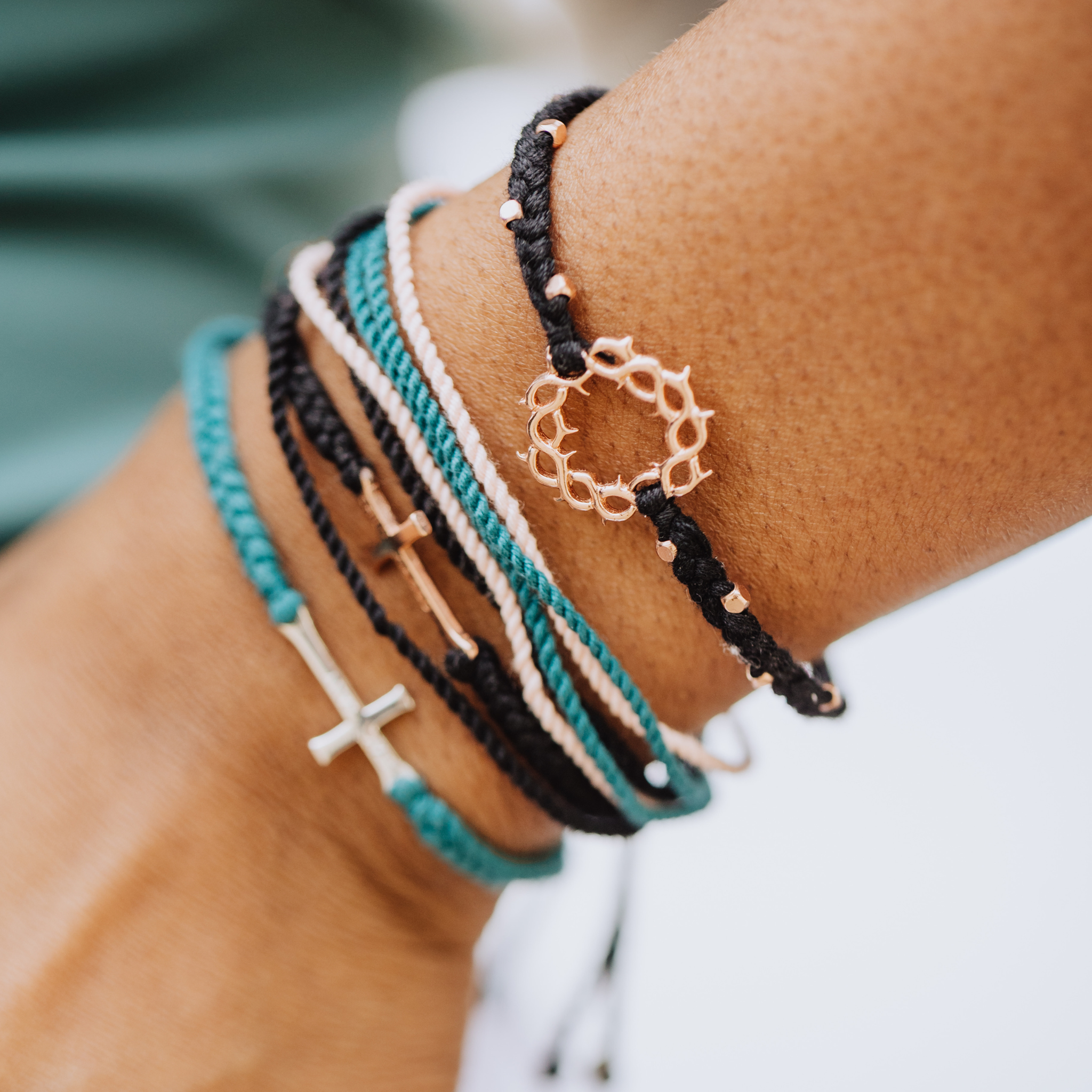 Rizen Jewelry made4Ministry black rose Gold Crown of thorns macrame bracelet layered with faith inspired cross  bracelets.