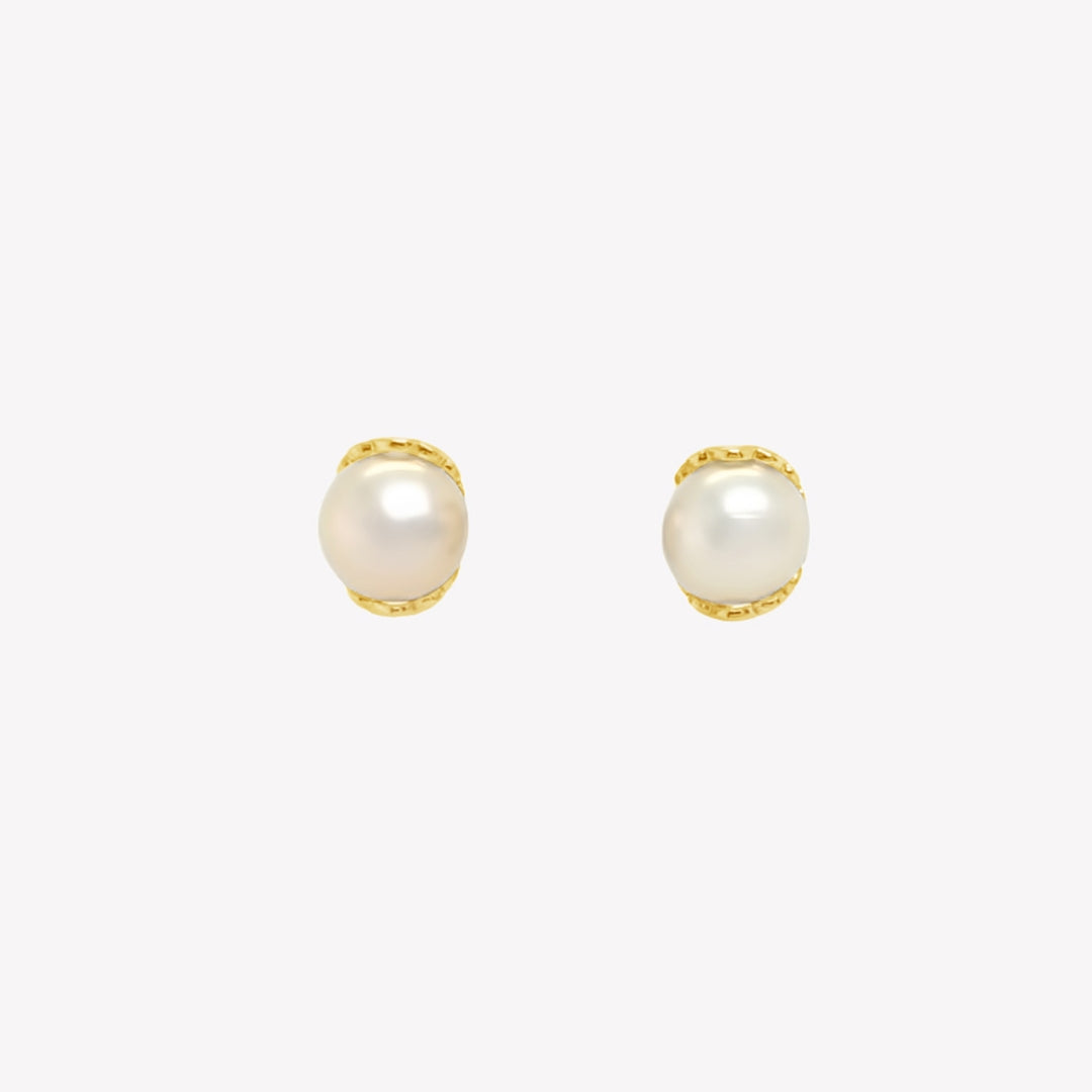 Rizen Jewelry gold shell encased pearl earring from the Becoming Collection.