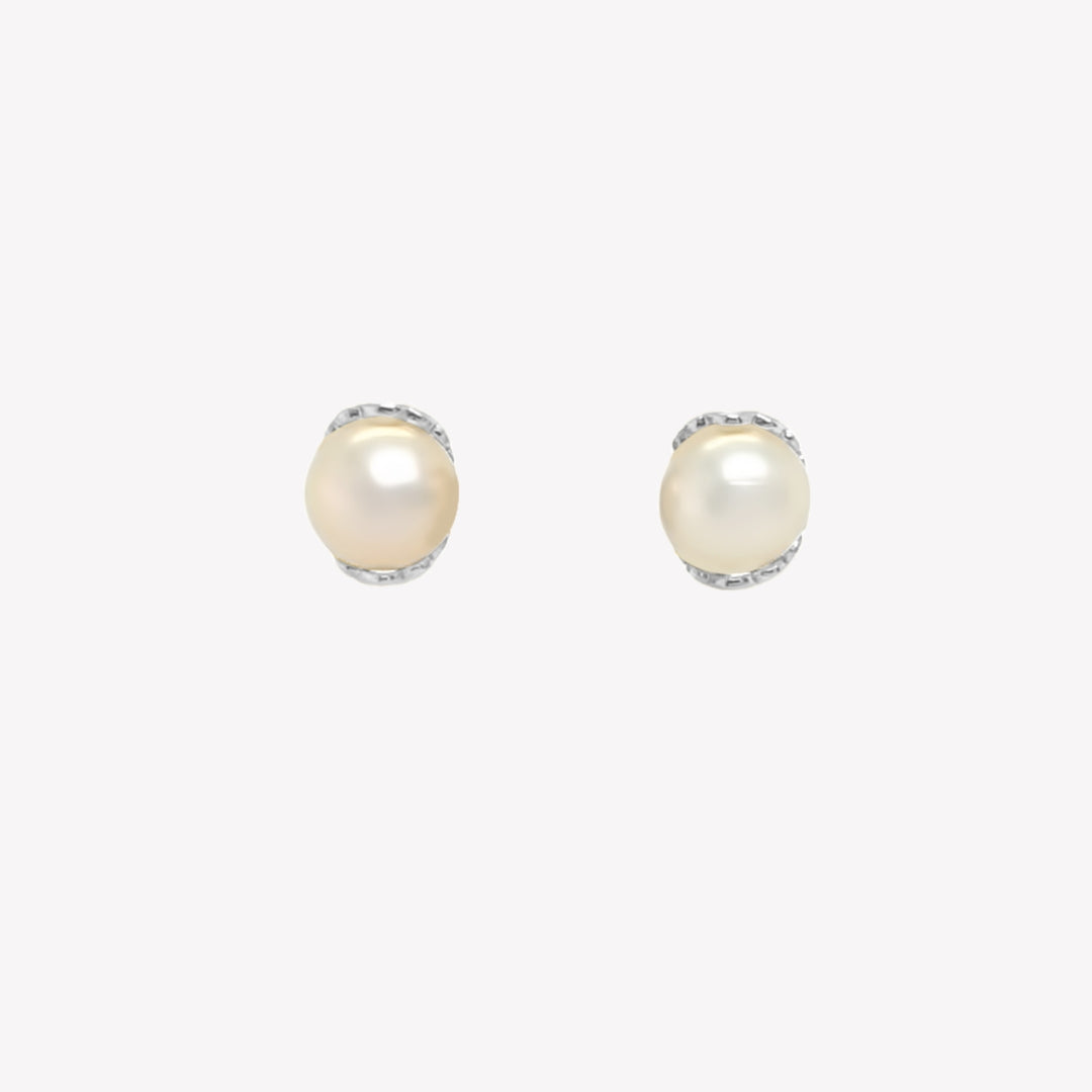Rizen Jewelry shell encased pearl earring in sterling silver from the Becoming Collection. 