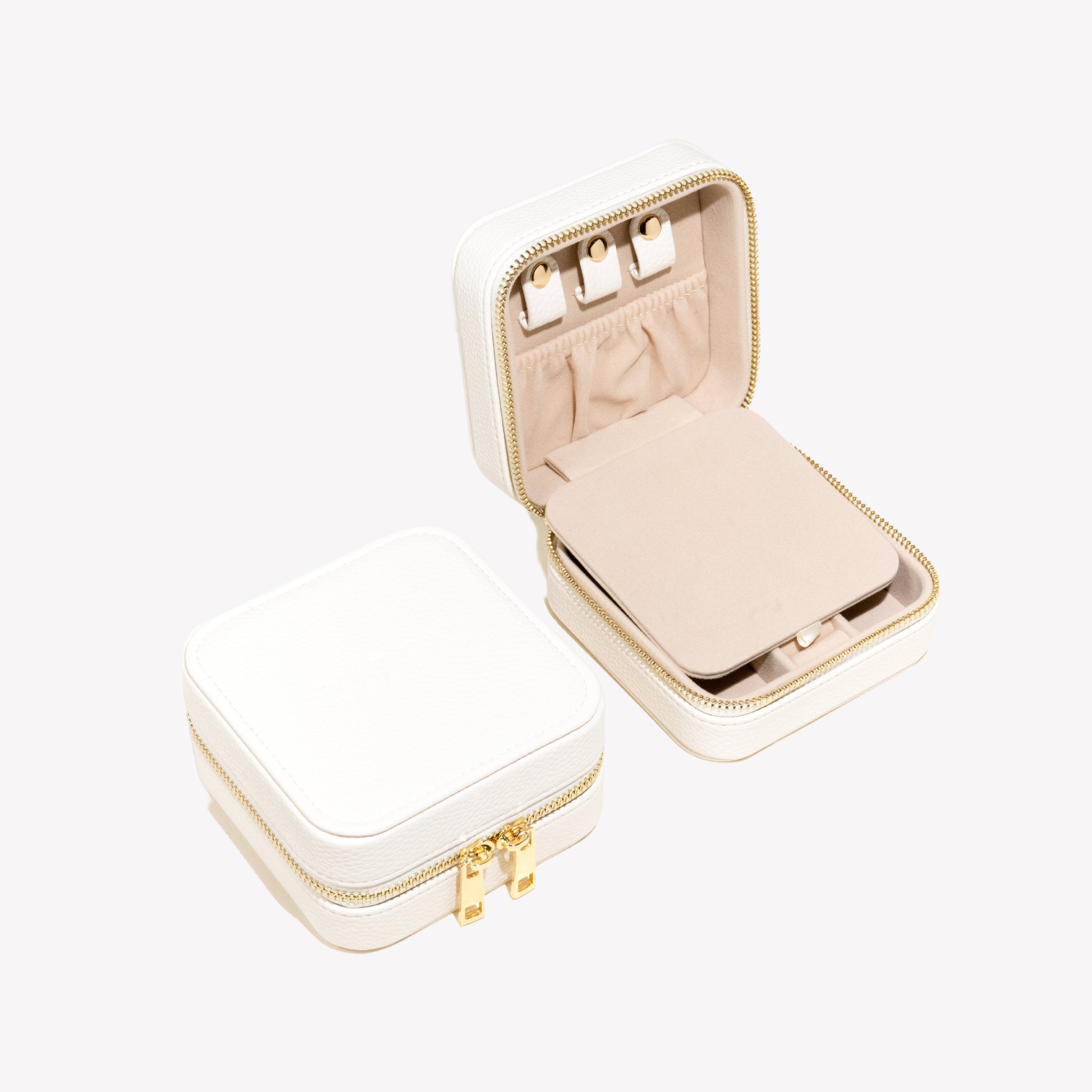 White pebbles leather Rizen Jewelry box with off white velvet interior, featuring 3 leather snaps  and elastic pocket to keep necklaces and bracelets organized.