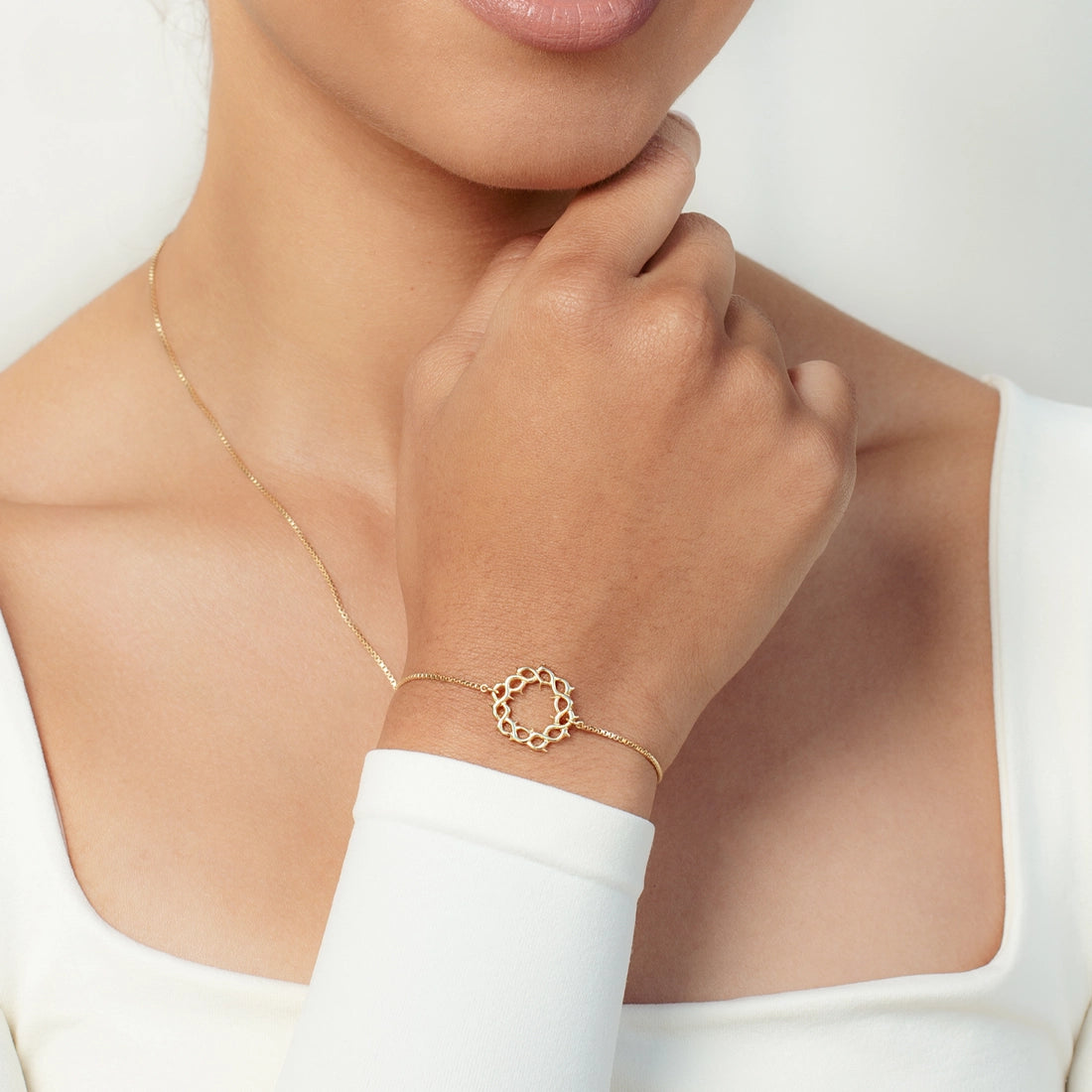 Christian woman earring gold Crown of Thorns Bracelet from the Insignia Collection by Rizen Jewelry.