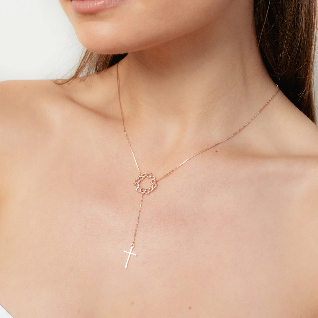 Close up of 18k rose gold vermeil Crown of Thorns Y Necklace with cross pendant from the Insignia Collection by Rizen Jewelry.