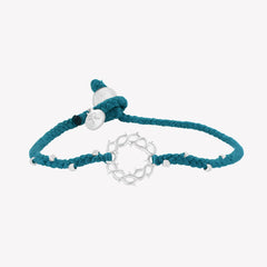 Azure blue braided friendship bracelet with silver crown of thorns pendant and 8 dainty beads with a pumpkin bead closure and a Rizen Jewelry Made 4 Ministries round tag.