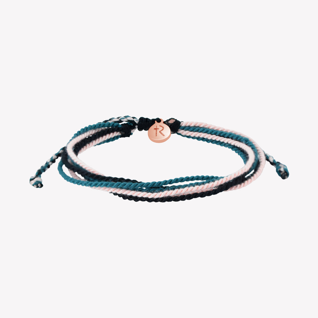 Christian friendship bracelet with black, azure blue and pink cords.  Rose Gold Rizen Jewelry and Made 4 Ministries tag.