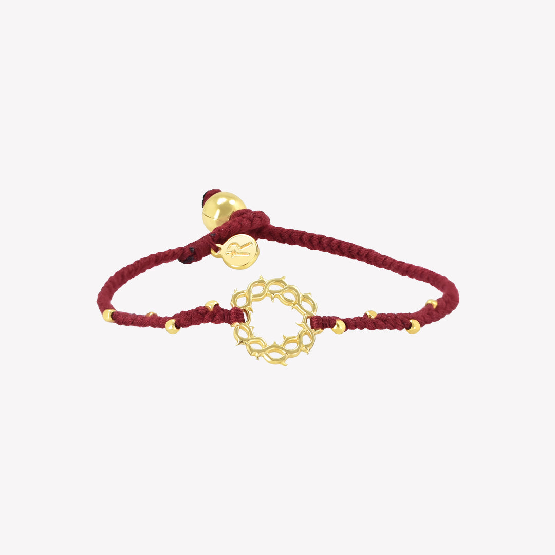 Garnet red friendship bracelet with gold crown of thorns pendant and 8 dainty beads with a pumpkin bead closure and a Rizen Jewelry Made 4 Ministries round tag.  