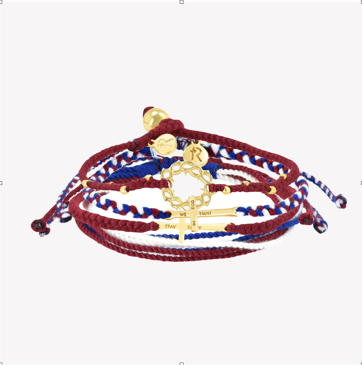 Rizen Jewelry Made 4 Ministries gold We Trust in God Bracelet Set. Featuring Red Garnet Beaded Crown of Thorns; Red, White, and Blue We Trust in God Cross bracelet; Garnet Red STAY SALTY braided bracelet; and peaceful Red, White, and Blue Be Magnified multi-cord bracelet. 